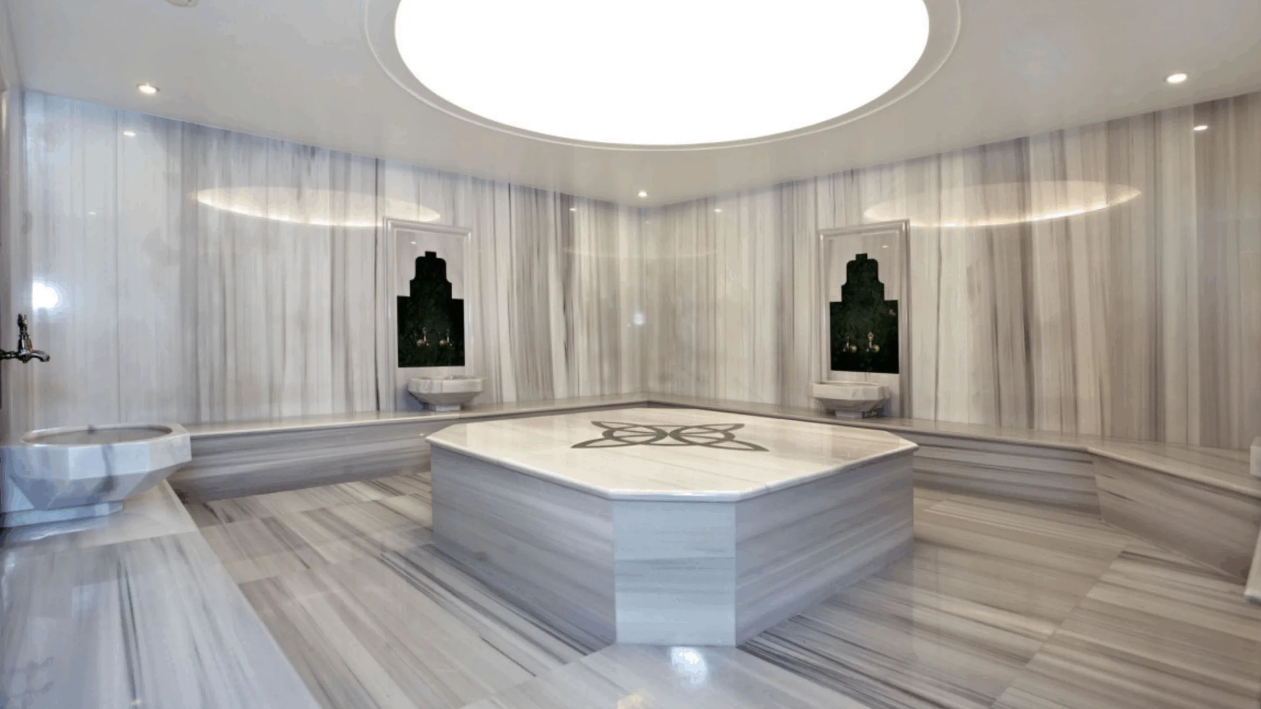 Traditional Turkish hammam with marble interior and steam, offering relaxation.